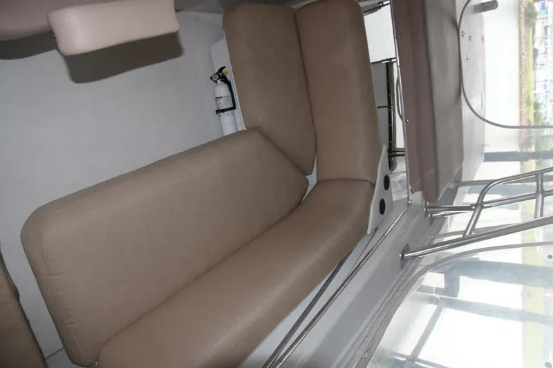 Aurora II Yacht Photos Pics Interior seating of 1989 Chris-Craft 480 Catalina yacht, featuring beige upholstery.