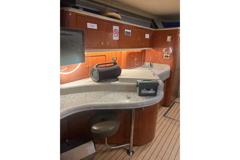 Oceanmax Yacht Photos Pics Interior of 2000 Sea Ray 450 Express Bridge yacht with modern kitchen amenities.