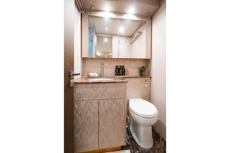  Yacht Photos Pics Luxurious yacht bathroom with modern fixtures, marble countertop, and elegant decor on Arno Leopard 24.