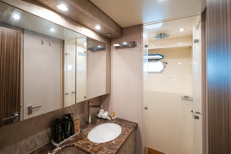  Yacht Photos Pics Luxurious bathroom in 2006 Arno Leopard 24 yacht with marble countertop and modern fixtures.