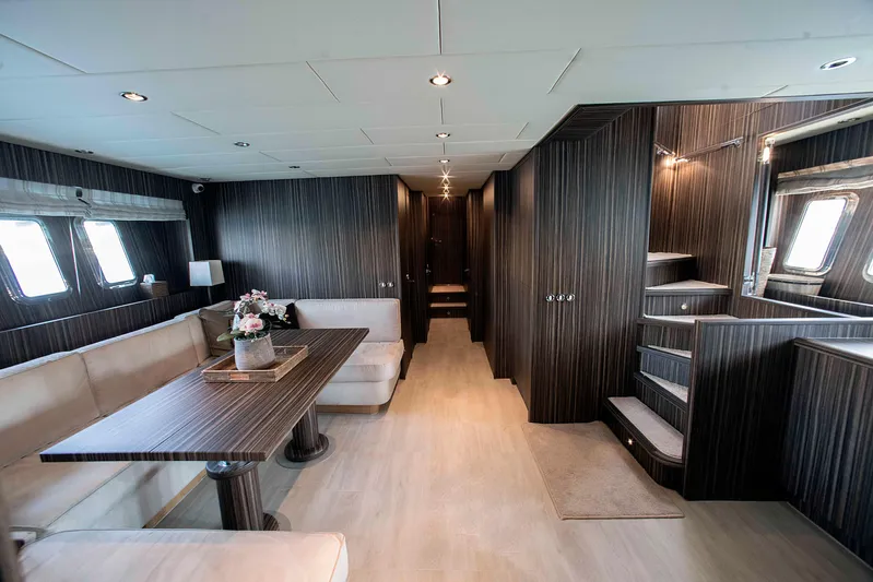  Yacht Photos Pics Luxurious interior of 2006 Arno Leopard 24 yacht with elegant wood finishes and modern seating.