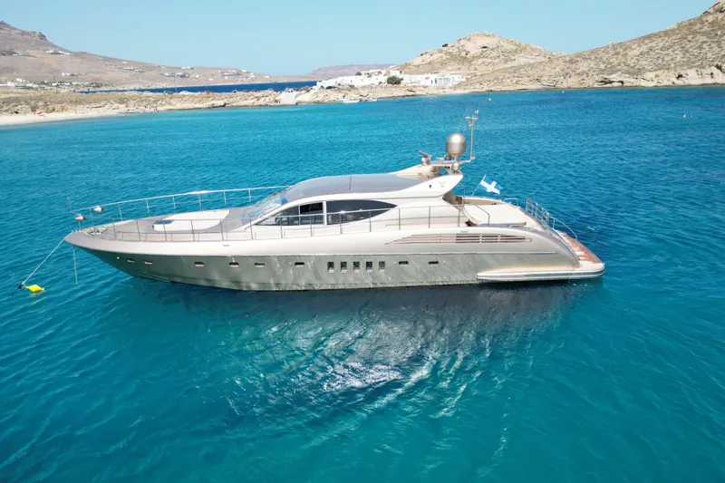 Yacht Photos Pics Luxurious 2006 Arno Leopard 24 yacht on clear blue waters near rocky coastline.