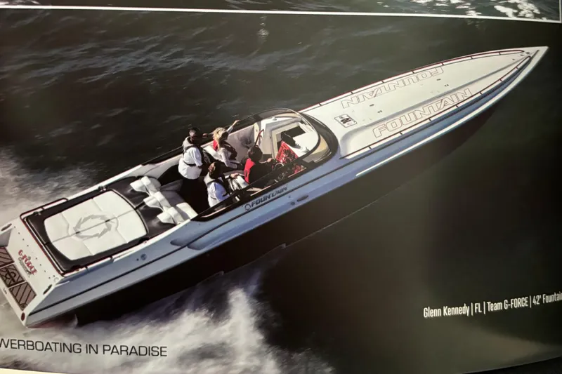  Yacht Photos Pics 2007 Fountain 42 Lightning speedboat cruising on water with passengers onboard.