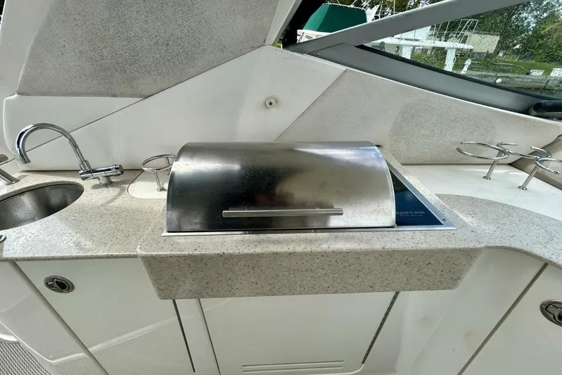  Yacht Photos Pics 2009 Sea Ray 310 Sundancer boat kitchenette with sink and grill.