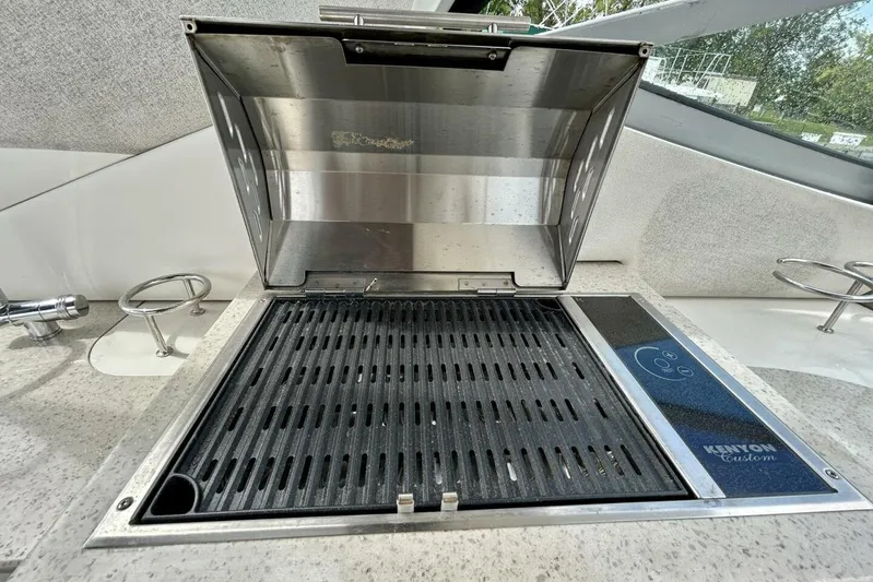  Yacht Photos Pics Built-in grill on 2009 Sea Ray 310 Sundancer boat, featuring Kenyon Custom design.