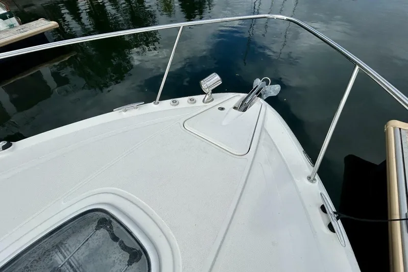  Yacht Photos Pics Bow of 2009 Sea Ray 310 Sundancer, featuring anchor and stainless steel railings.