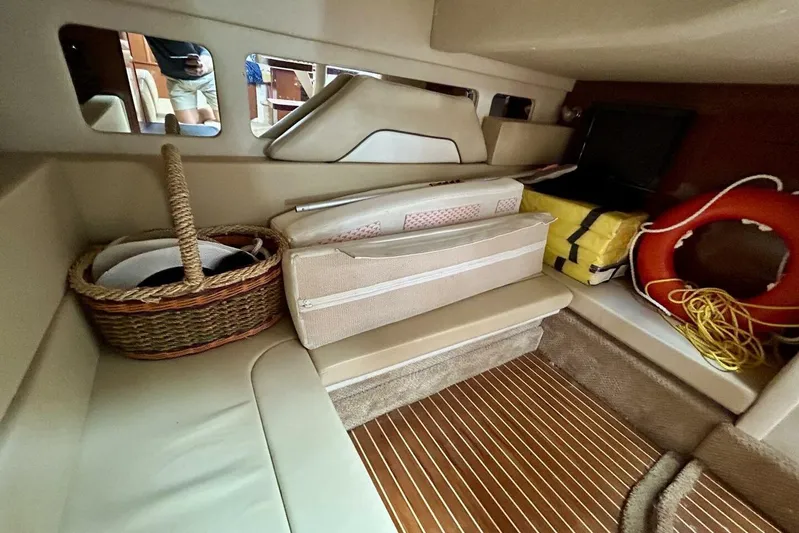  Yacht Photos Pics Interior of 2009 Sea Ray 310 Sundancer with basket, life preserver, and cushions.