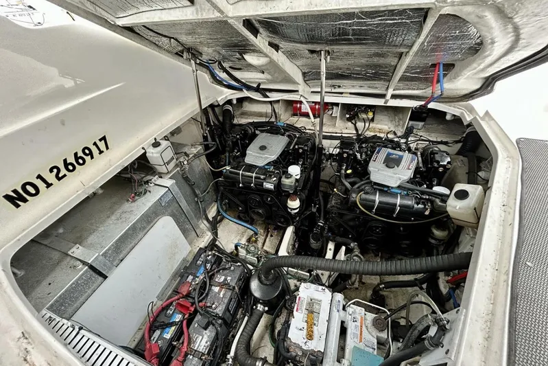  Yacht Photos Pics Engine compartment of a 2009 Sea Ray 310 Sundancer boat, showcasing dual engines and components.