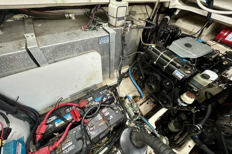  Yacht Photos Pics Engine compartment of a 2009 Sea Ray 310 Sundancer, showcasing batteries and mechanical components.