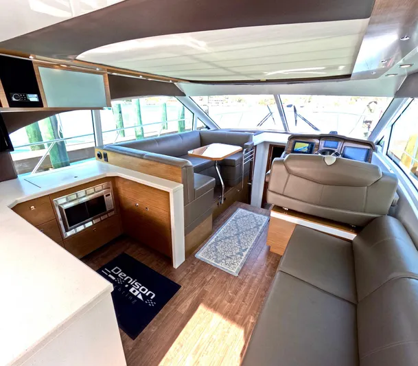  Yacht Photos Pics Interior of 2016 Cruisers Yachts Cantius 45, featuring modern seating and navigation area.