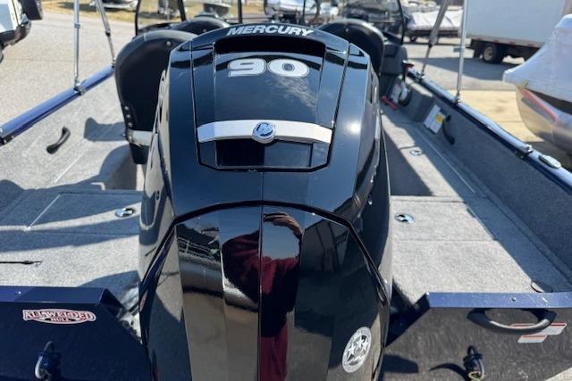 2023 Tracker Pro Guide V-16 WT boat with Mercury 90 engine, rear view.