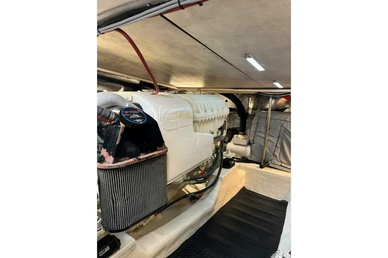 Fortuna Yacht Photos Pics Engine room of 2002 Riviera 43 Open Flybridge yacht, showcasing a powerful engine setup.