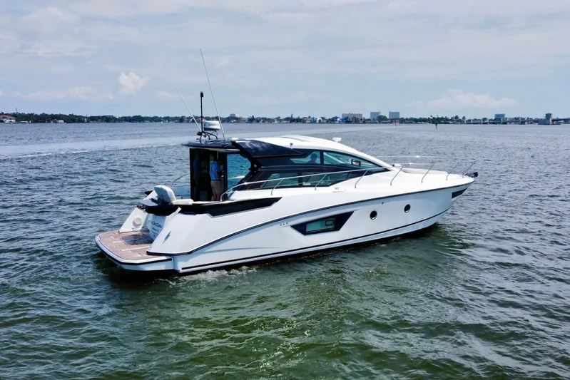  Yacht Photos Pics 2018 Beneteau Gran Turismo 46 yacht cruising on open water.