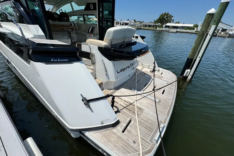  Yacht Photos Pics 2018 Beneteau Gran Turismo 46 yacht docked at marina, rear view.