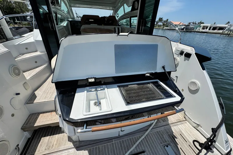  Yacht Photos Pics 2018 Beneteau Gran Turismo 46 yacht with outdoor grill and sink on deck.
