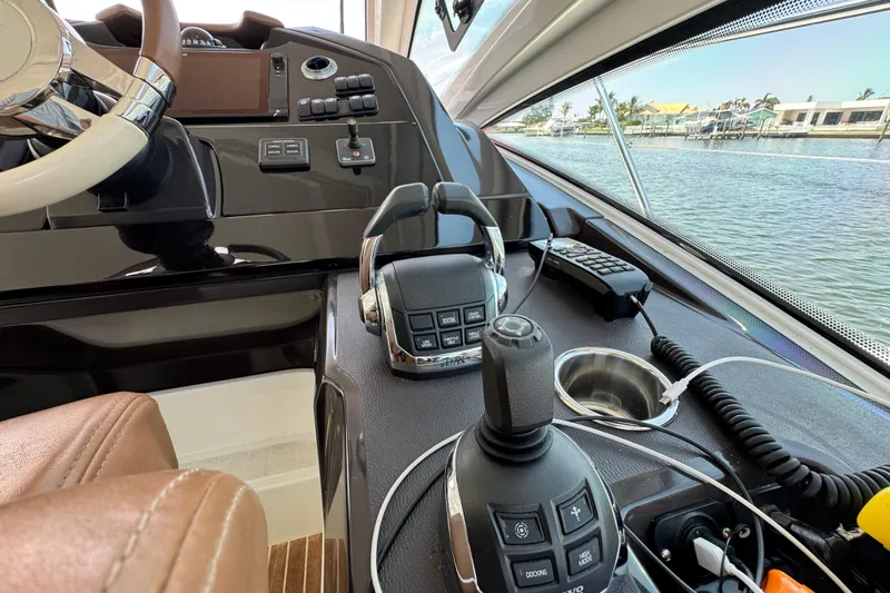  Yacht Photos Pics Cockpit of 2018 Beneteau Gran Turismo 46 yacht with steering controls and navigation equipment.