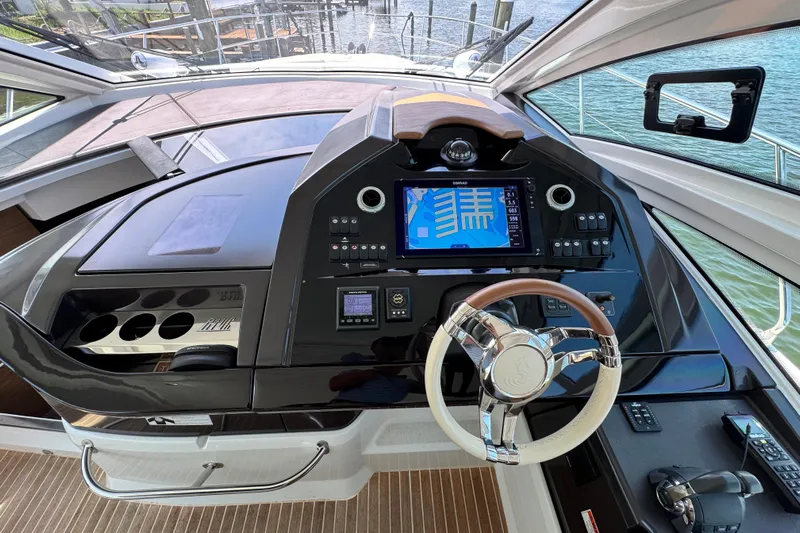  Yacht Photos Pics Cockpit of 2018 Beneteau Gran Turismo 46 yacht with modern navigation system and steering wheel.