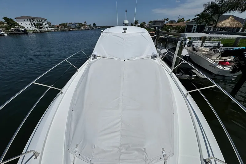  Yacht Photos Pics 2018 Beneteau Gran Turismo 46 yacht docked in a scenic waterfront location.