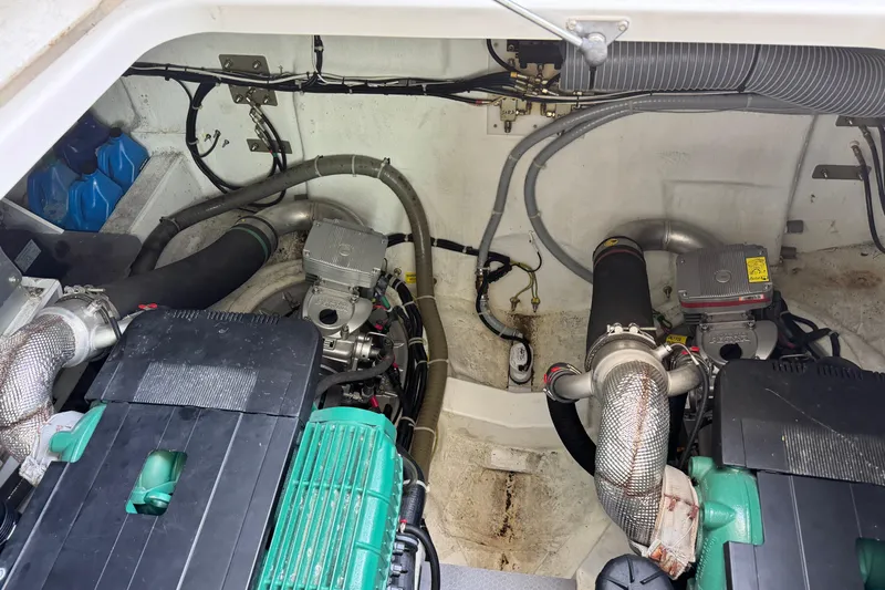  Yacht Photos Pics Engine room of 2018 Beneteau Gran Turismo 46, showcasing dual engines and mechanical components.