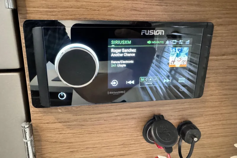  Yacht Photos Pics Fusion audio system on 2018 Beneteau Gran Turismo 46, displaying SiriusXM interface.