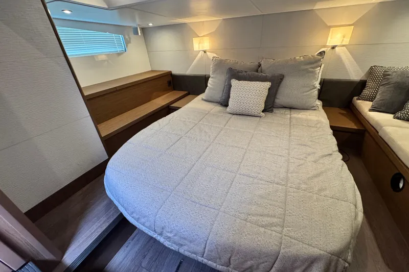  Yacht Photos Pics Luxurious cabin interior of 2018 Beneteau Gran Turismo 46 yacht with cozy bedding.