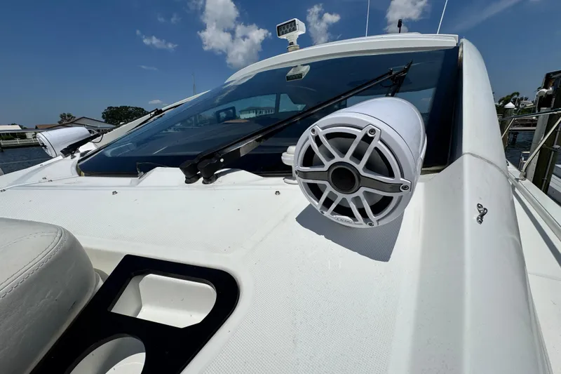  Yacht Photos Pics 2018 Beneteau Gran Turismo 46 yacht with speaker and windshield detail under clear sky.