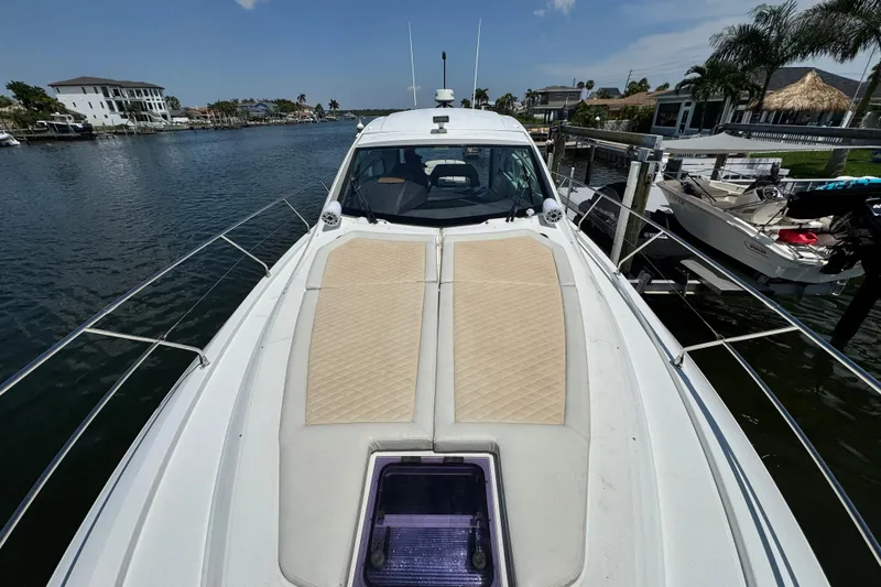  Yacht Photos Pics 2018 Beneteau Gran Turismo 46 yacht on a serene waterfront dock.