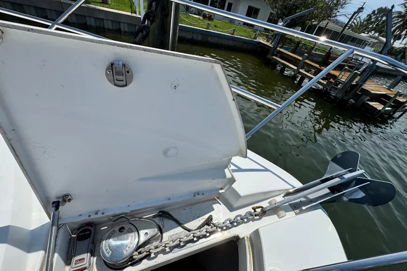  Yacht Photos Pics Open anchor compartment on 2018 Beneteau Gran Turismo 46 yacht, showing chain and winch.