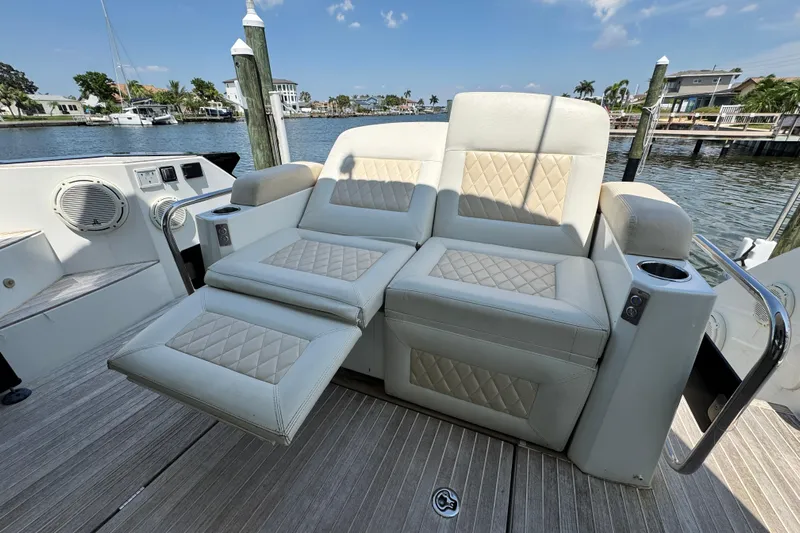  Yacht Photos Pics Luxurious seating on 2018 Beneteau Gran Turismo 46 yacht, featuring quilted upholstery and cup holders.