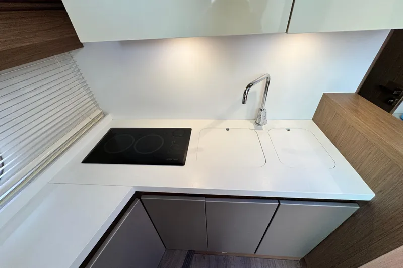  Yacht Photos Pics Modern kitchen area in 2018 Beneteau Gran Turismo 46 yacht with sleek design.