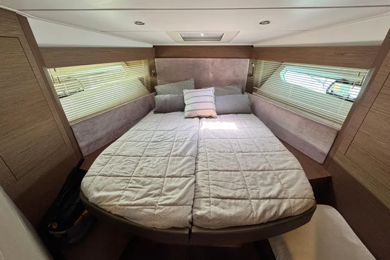  Yacht Photos Pics Luxurious cabin interior of 2018 Beneteau Gran Turismo 46 yacht with cozy bedding.