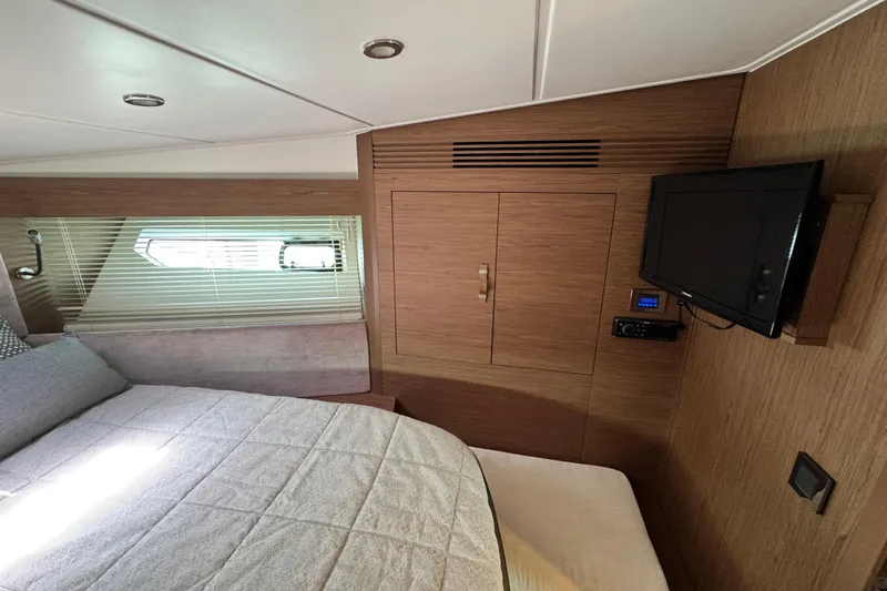  Yacht Photos Pics Luxurious cabin interior of 2018 Beneteau Gran Turismo 46 yacht with TV and window.