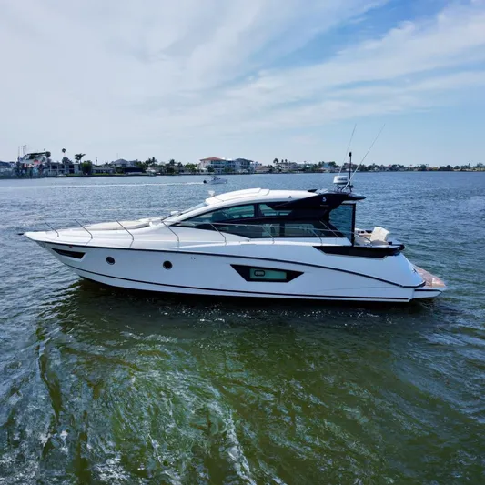 Yacht Photos Pics 2018 Beneteau Gran Turismo 46 yacht on calm water, showcasing sleek design and modern features.