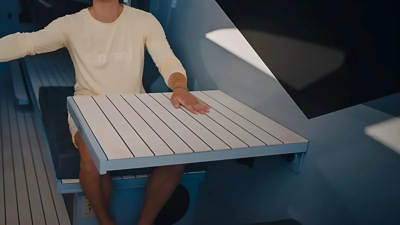 C´est Normal Yacht Photos Pics Dual Hidden Dining Tables on the 2022 C’est Normal 52R Hybrid