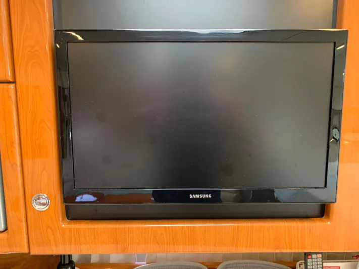  Yacht Photos Pics Samsung TV mounted on a 2005 Formula 34 Performance Cruiser's wooden interior.