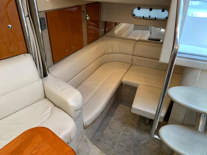  Yacht Photos Pics 2005 Formula 34 Performance Cruiser interior with beige leather seating and wooden accents.