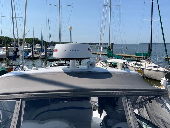  Yacht Photos Pics 2005 Formula 34 Performance Cruiser docked at marina with sailboats in background.
