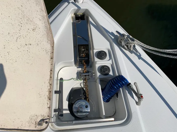  Yacht Photos Pics Anchor locker of a 2005 Formula 34 Performance Cruiser with coiled hose and winch.