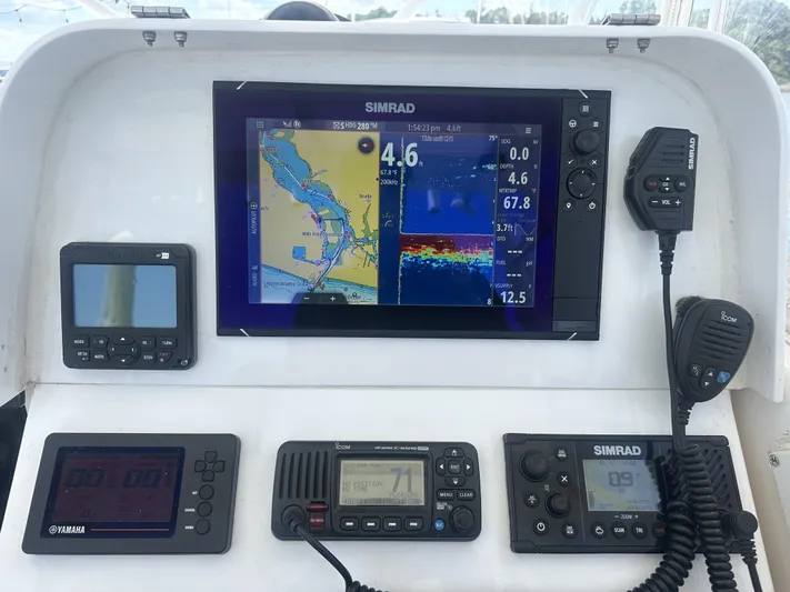  Yacht Photos Pics Control panel of a 2004 Contender 31 Fish Around boat with navigation and communication devices.