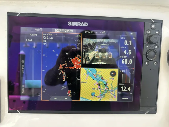  Yacht Photos Pics Simrad marine navigation display on 2004 Contender 31 Fish Around boat, showing radar and map data.