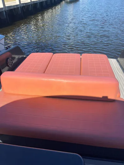  Yacht Photos Pics VanDutch 40 Open Bow 2013 with orange seating, docked by the water.