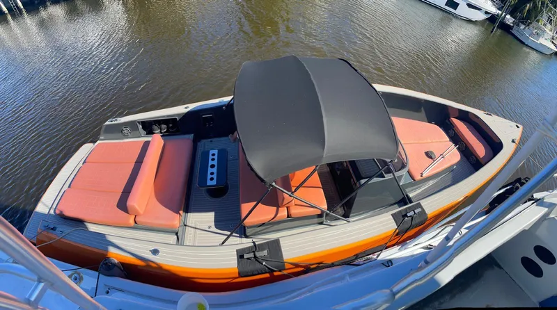  Yacht Photos Pics 2013 VanDutch 40 Open Bow boat with orange seating and black canopy on calm water.