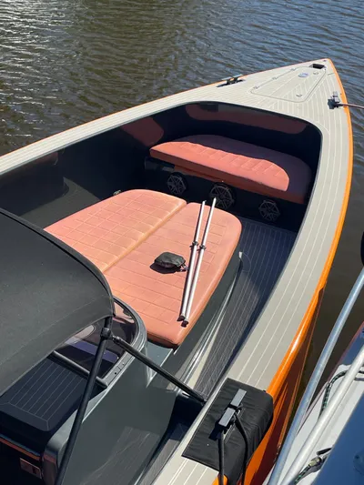  Yacht Photos Pics 2013 VanDutch 40 Open Bow boat with orange seating, docked on calm water.