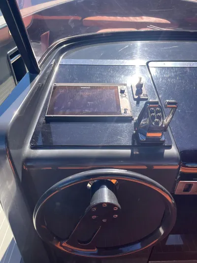  Yacht Photos Pics Steering wheel and controls of a 2013 VanDutch 40 Open Bow yacht.