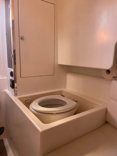  Yacht Photos Pics 2013 VanDutch 40 Open Bow yacht bathroom with compact toilet and sleek design.