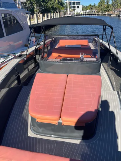  Yacht Photos Pics 2013 VanDutch 40 Open Bow yacht with orange seating, docked by a waterfront.