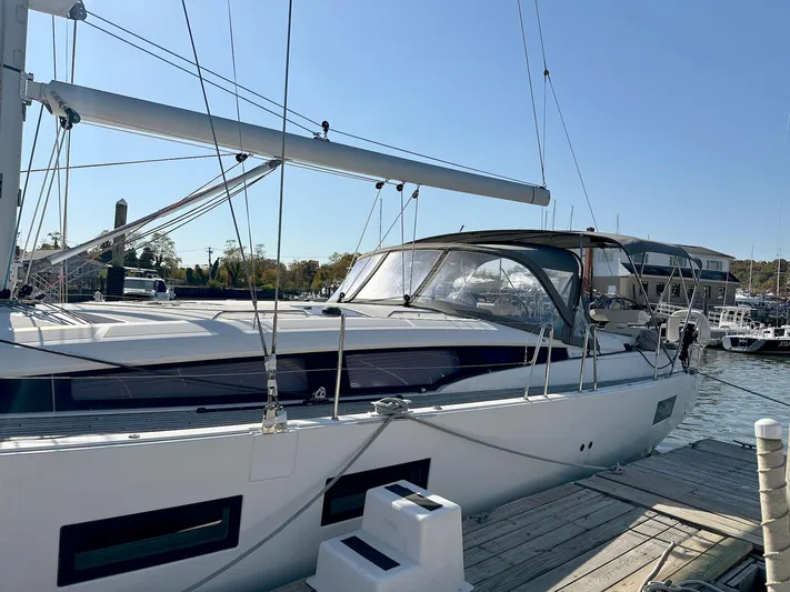  Yacht Photos Pics 2018 Jeanneau 51 sailboat docked at marina under clear blue sky.