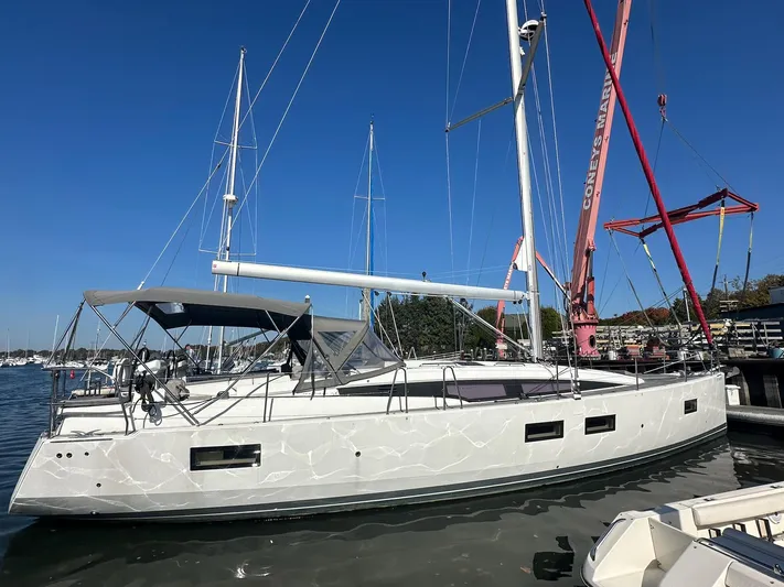  Yacht Photos Pics 2018 Jeanneau 51 sailboat docked under clear blue sky.