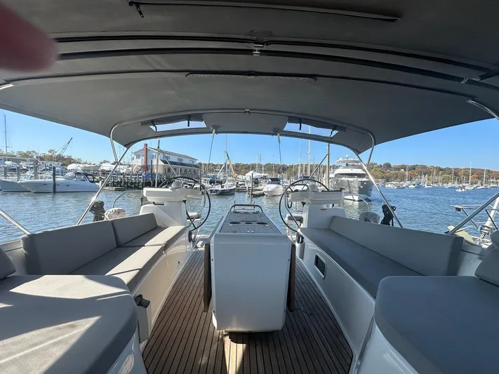  Yacht Photos Pics 2018 Jeanneau 51 yacht interior with spacious seating, docked at a marina.