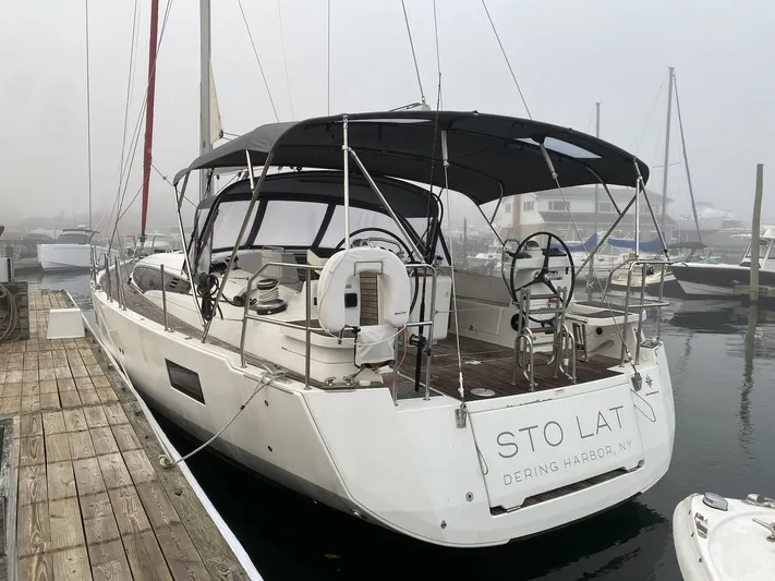  Yacht Photos Pics 2018 Jeanneau 51 sailboat docked in a foggy marina.